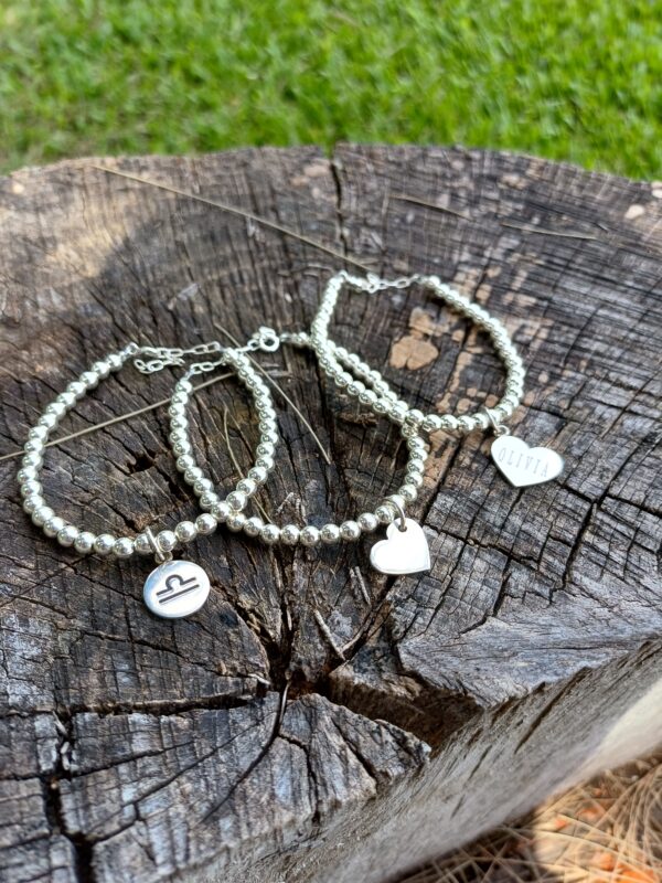 Pulseras bolas de 4mm con dije
